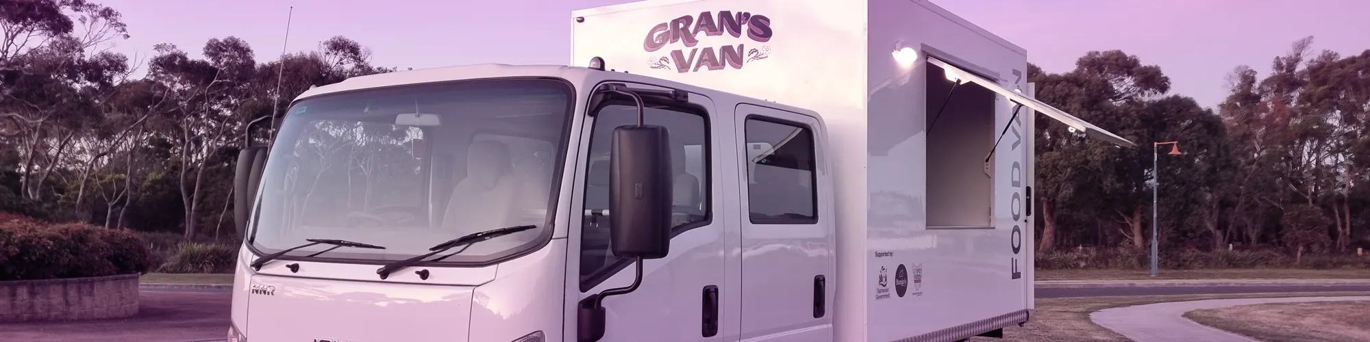 The Gran's Van food van parked at dusk with its serving window open